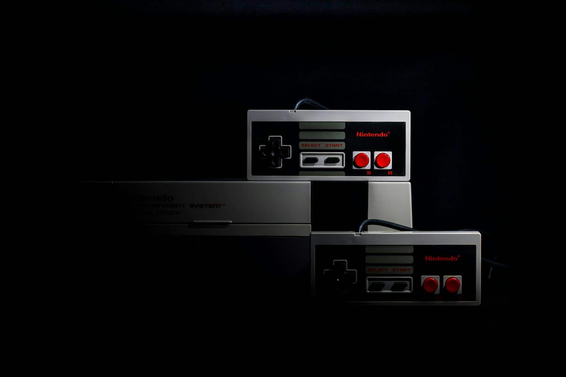 Retro Nintendo gaming controllers on dark background representing highest rated games of all time