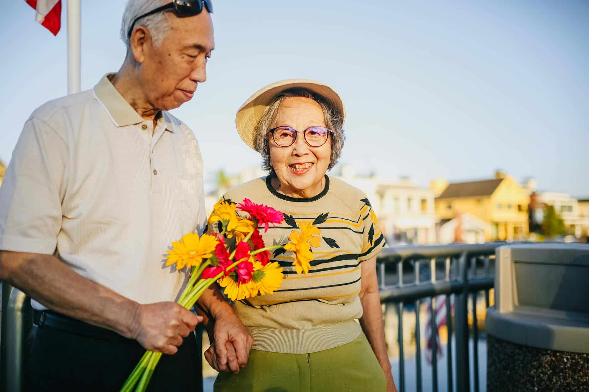 Elderly people enjoying outdoor life in a warm climate community